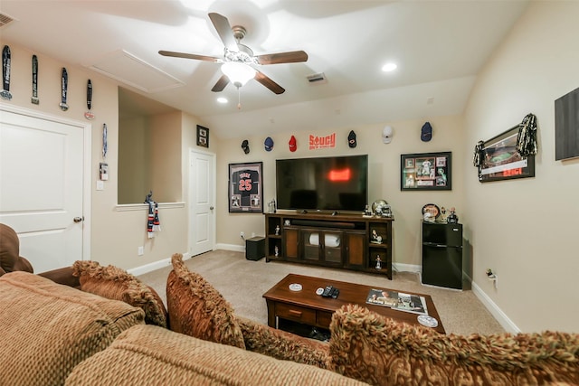 living room with ceiling fan, light colored carpet, and vaulted ceiling