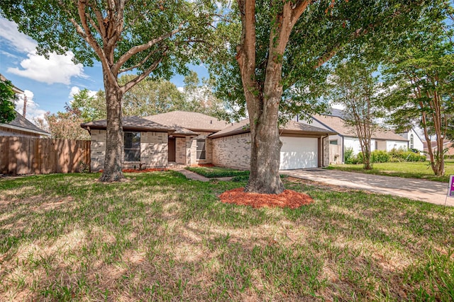 ranch-style house with a front yard and a garage