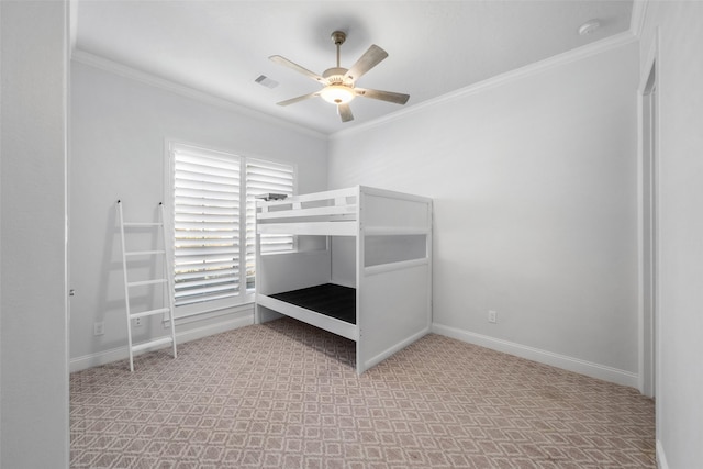 unfurnished bedroom with ceiling fan, ornamental molding, and light carpet