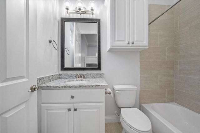 full bathroom with vanity, toilet, and tiled shower / bath