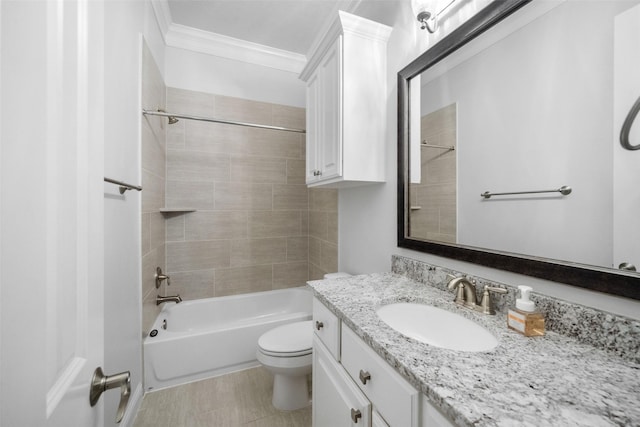 full bathroom featuring tiled shower / bath combo, toilet, crown molding, and vanity