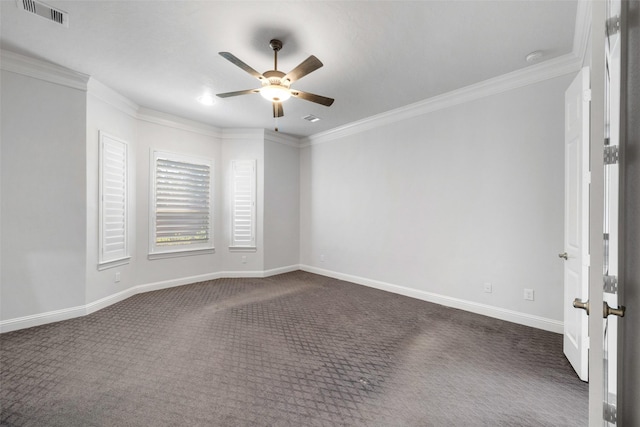 unfurnished room with dark colored carpet, ceiling fan, and ornamental molding