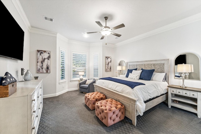 carpeted bedroom with ceiling fan and ornamental molding