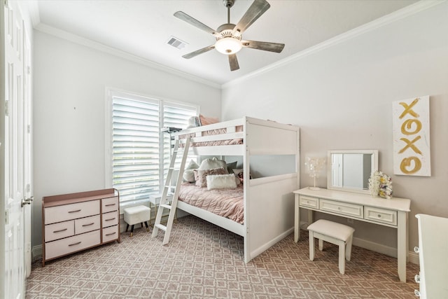 bedroom with ceiling fan and crown molding