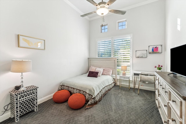 bedroom with dark colored carpet and ceiling fan