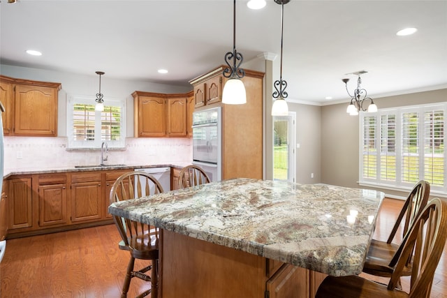 kitchen featuring pendant lighting, sink, and a center island