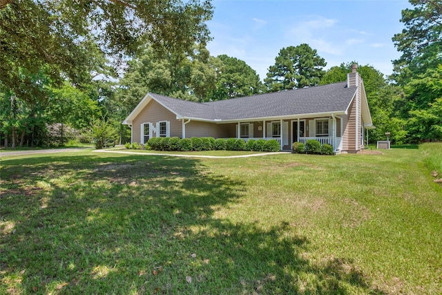 single story home featuring covered porch and a front lawn