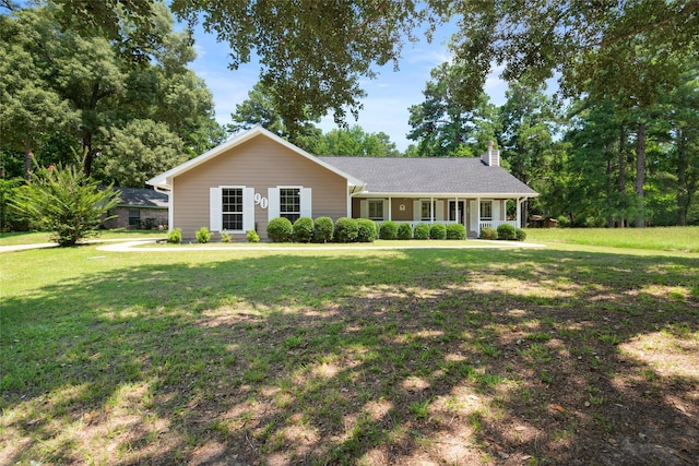 single story home featuring a porch and a front lawn