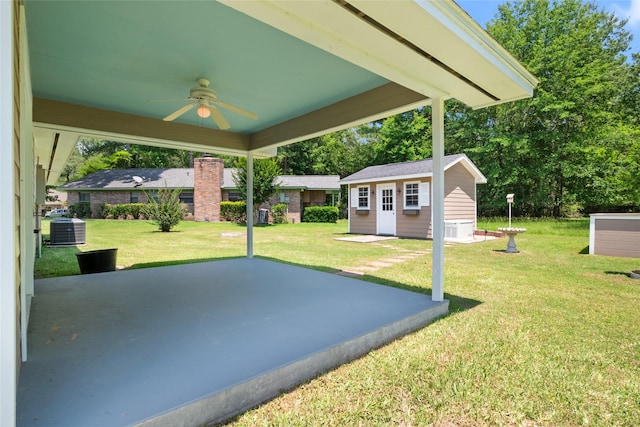 view of patio / terrace featuring an outbuilding, central AC unit, and ceiling fan