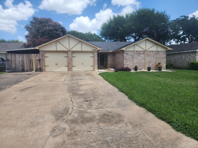 view of front of home featuring a front lawn and a garage