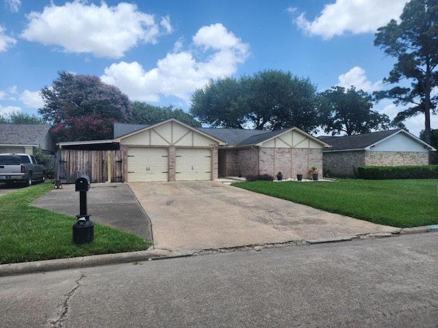 view of front of home featuring a garage and a front yard