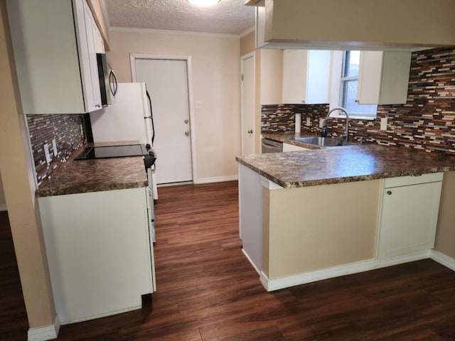 kitchen with white cabinets, backsplash, and sink