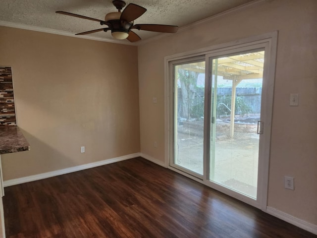 spare room with ceiling fan, crown molding, a textured ceiling, and dark wood-type flooring