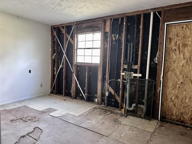 misc room featuring a textured ceiling