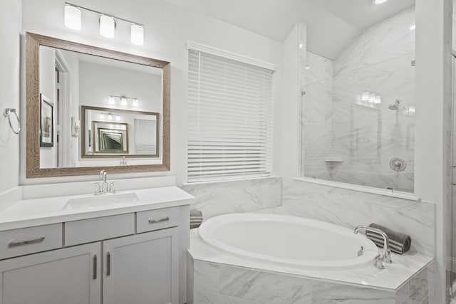 bathroom with plus walk in shower and vanity