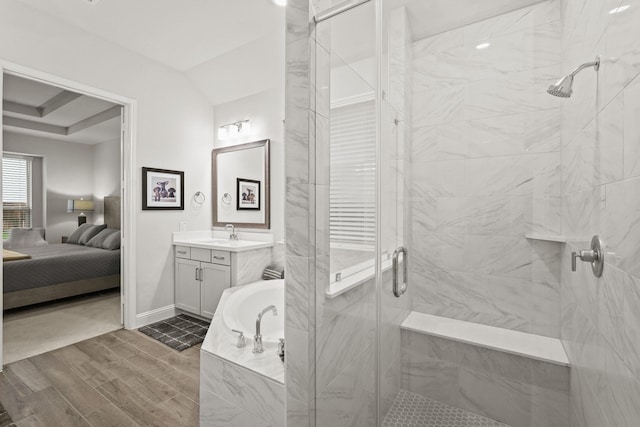 bathroom with vanity and separate shower and tub