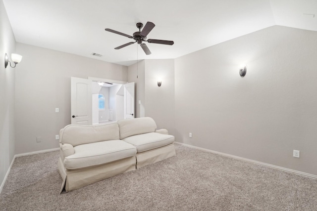 living room with light colored carpet, vaulted ceiling, and ceiling fan