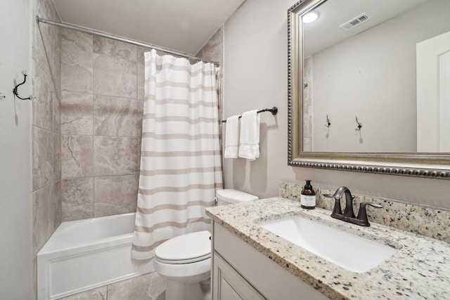 full bathroom with tile patterned floors, vanity, toilet, and shower / tub combo with curtain