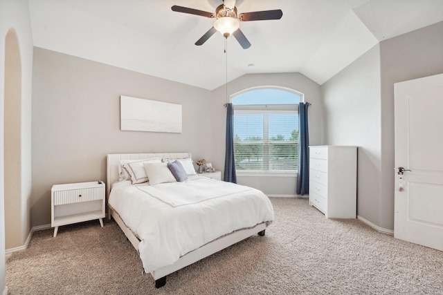 bedroom featuring ceiling fan, carpet floors, and vaulted ceiling