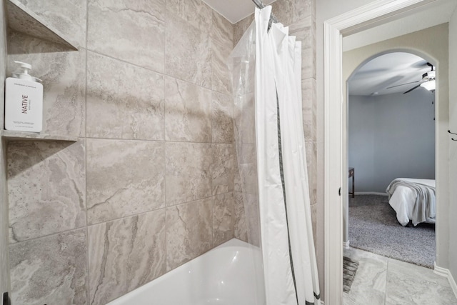 bathroom featuring shower / bathtub combination with curtain and ceiling fan