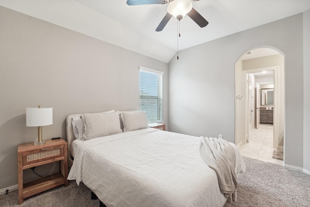 carpeted bedroom featuring vaulted ceiling and ceiling fan