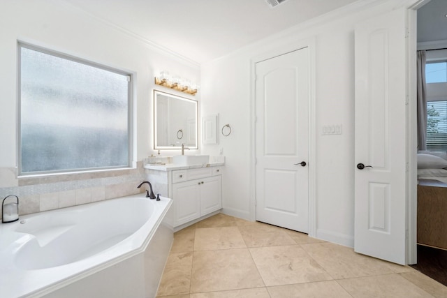 bathroom featuring tile patterned flooring, vanity, plenty of natural light, and ornamental molding