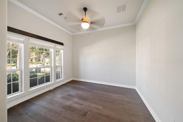 spare room featuring dark hardwood / wood-style floors, ceiling fan, and crown molding