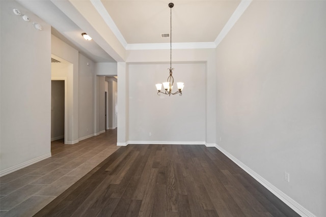 unfurnished dining area featuring a notable chandelier, dark hardwood / wood-style flooring, and ornamental molding