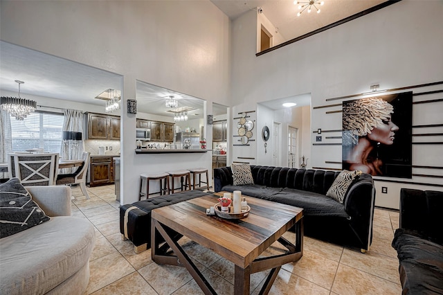 tiled living room featuring an inviting chandelier