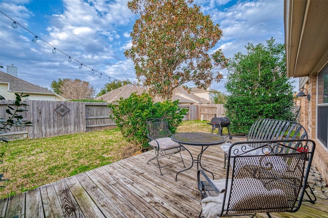 wooden deck with a yard