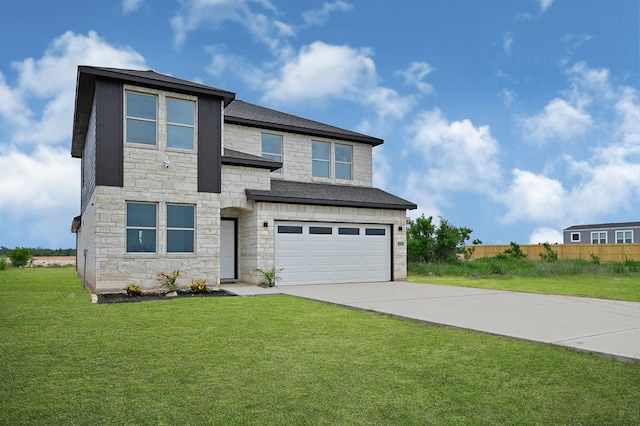 view of front facade with a front yard and a garage