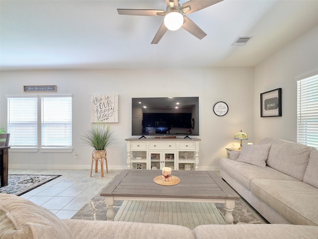 living room featuring ceiling fan and light tile patterned flooring