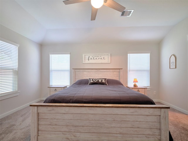 carpeted bedroom featuring ceiling fan and vaulted ceiling