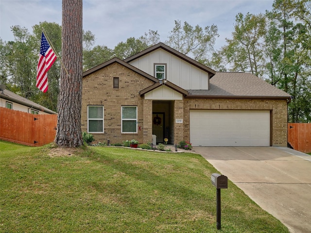 view of front of home featuring a front yard and a garage