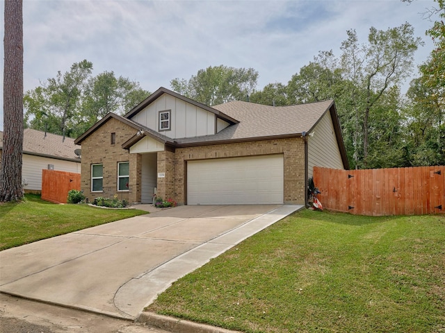 view of front of house with a front yard and a garage