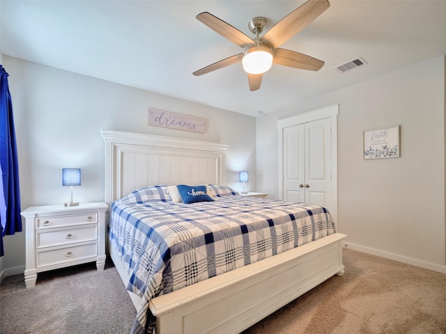 bedroom with carpet flooring, ceiling fan, and a closet