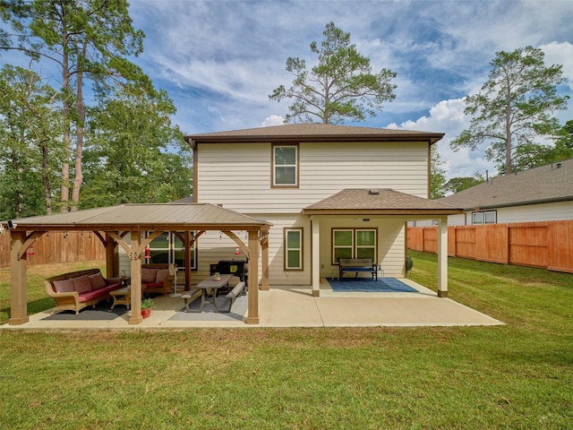 back of property with outdoor lounge area, a yard, and a patio