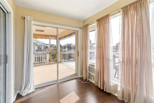 doorway featuring dark hardwood / wood-style floors