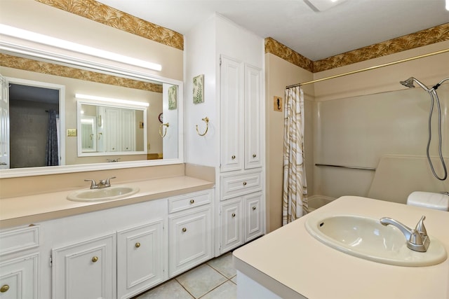 bathroom featuring tile patterned floors and vanity