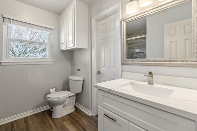 bathroom featuring hardwood / wood-style flooring, vanity, and toilet