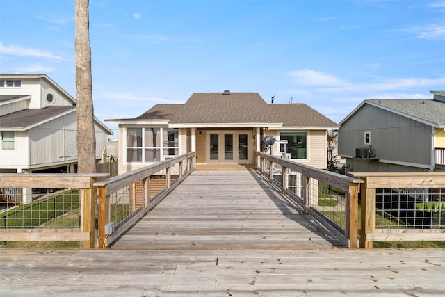 back of house featuring a sunroom and cooling unit