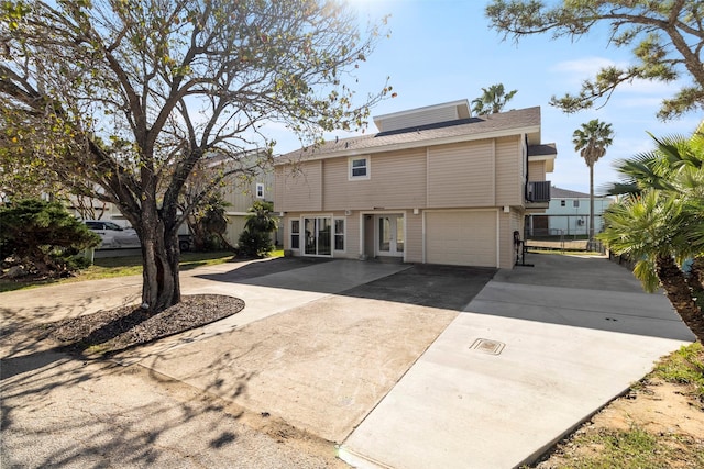 back of property featuring a garage