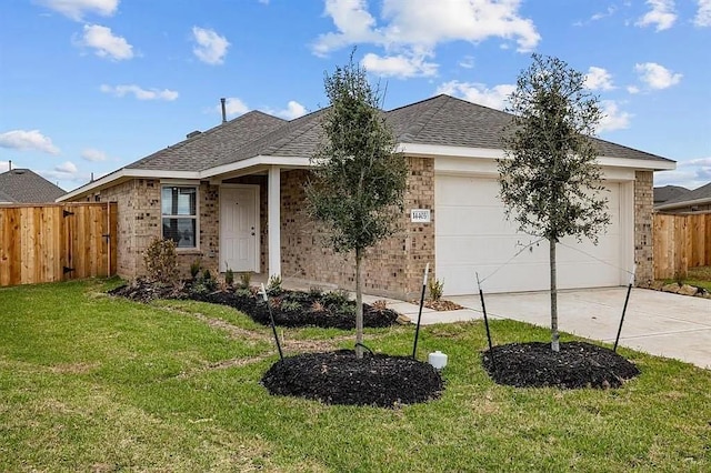 single story home featuring a garage and a front lawn