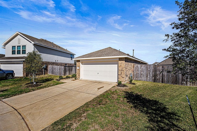 view of home's exterior with a garage and a yard