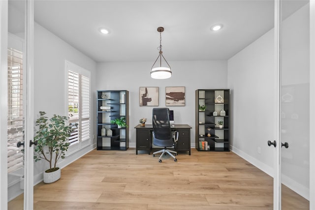 office space featuring light hardwood / wood-style floors and french doors