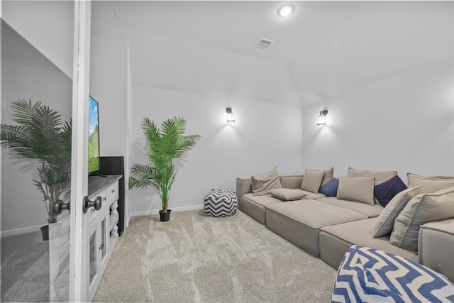 living room with light colored carpet and lofted ceiling