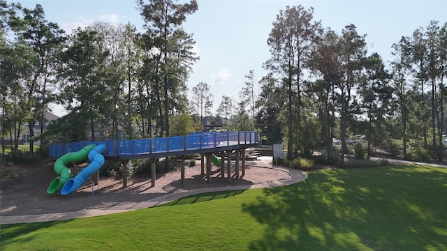 view of jungle gym featuring a lawn