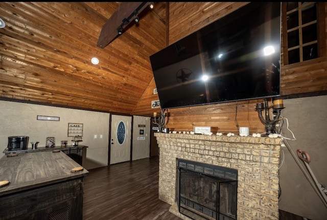 interior space featuring dark hardwood / wood-style flooring, beam ceiling, high vaulted ceiling, wooden ceiling, and a fireplace