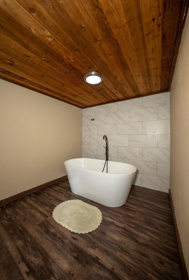 bathroom featuring a bathtub, wood-type flooring, wooden ceiling, and tile walls