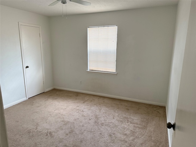 carpeted spare room with a healthy amount of sunlight